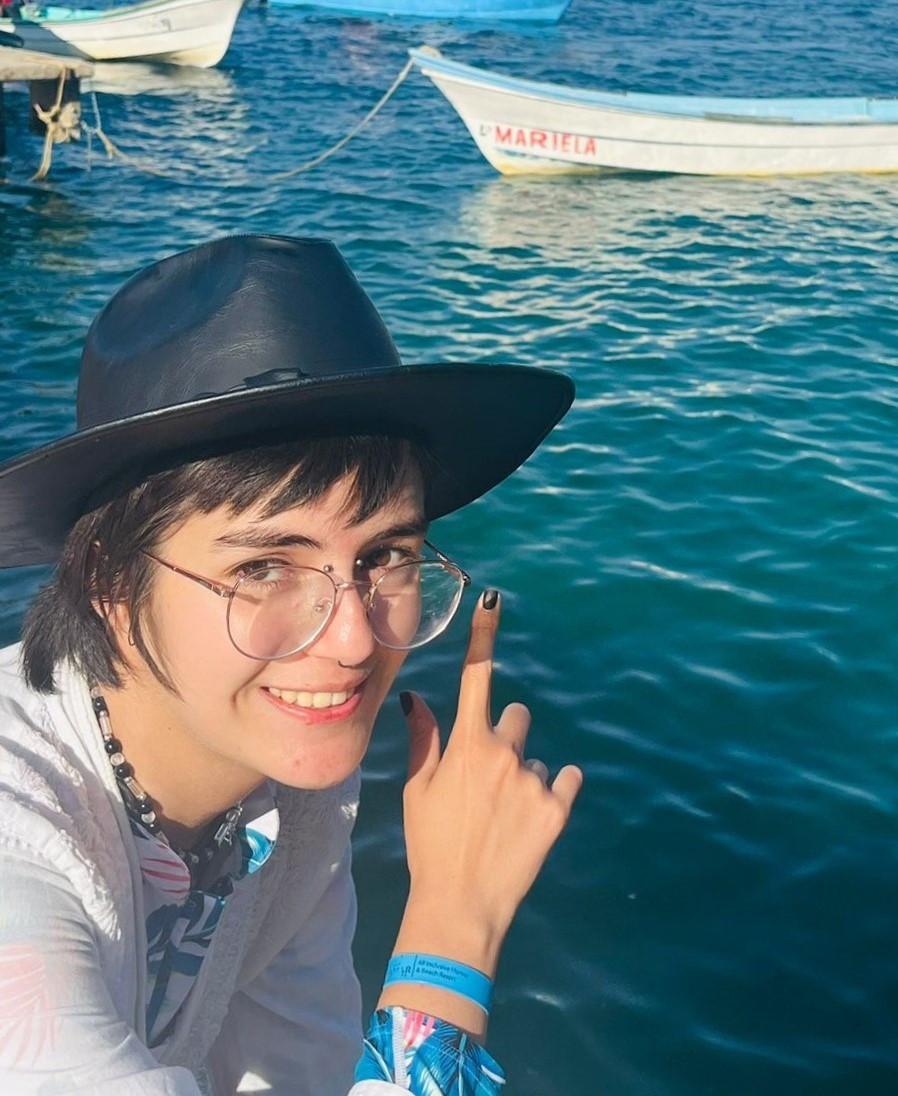 Picture of me pointing at a random boat I found that has my name.